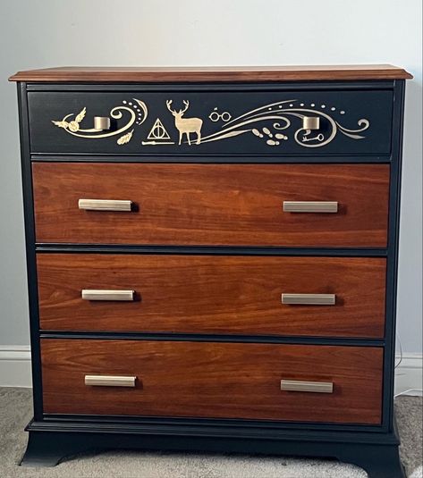 Simplistic and elegant Harry Potter inspired dresser with Folkart Treasure Gold mayan gold paint and champagne gold hardware from Lowes. Stencil created with Cricut and Oracle stencil vinyl, and Oracle transfer vinyl. Harry Potter Chest Of Drawers, Harry Potter Dresser Ideas, Harry Potter Bedroom Ideas Adults, Harry Potter Dresser Diy, Harry Potter Furniture Ideas, Harry Potter Dresser, Luna Nursery, Harry Potter Inspired Room, Harry Potter Inspired Bedroom