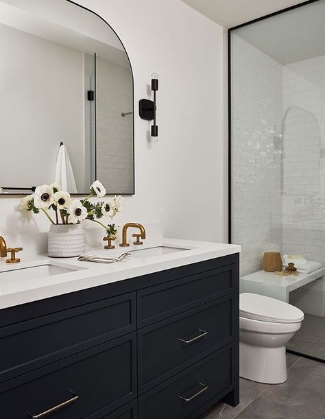 The principal bathroom is sleek and streamlined. Jessica added the brass faucets for a touch of warmth. Black And White Bathroom Vanity, Fixer Upper Interior, White Bathroom Vanity, Black And White Bathroom, Elegant Kitchen Design, Interior Design Programs, Black Vanity Bathroom, Black Vanity, Classic Bathroom