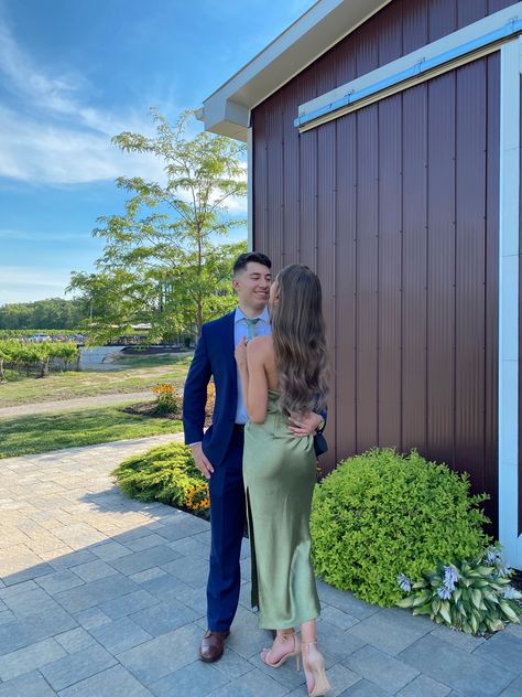 Cute Wedding Guest Couples, Green Fall Wedding Guest Dress, Couples Wedding Guest Poses, Wedding Guest Couple Photos, Wedding Guest Date Poses, Couple At Wedding Guest, Green Wedding Guest Outfit Couple, Sage Green Wedding Guest Outfit, Wedding Guest Photo Ideas Couple