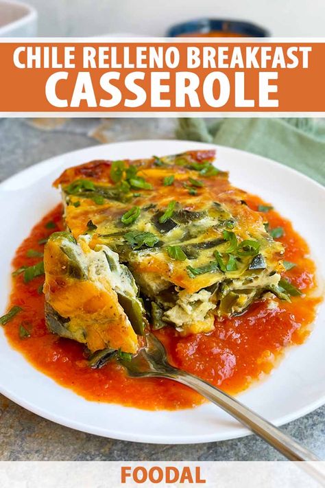 The next time you’re craving classic chiles rellenos, skip the stuffing, battering, and frying and make our easy breakfast casserole instead. It's layered with smoky poblano peppers and shredded cheese, and served over a tangy tomato sauce flavored with onions, garlic, and cumin. #chilerelleno #casserole #foodal Relleno Casserole Recipe, Chile Relleno Casserole Recipe, Relleno Casserole, Chile Relleno Casserole, Easy Breakfast Casserole, Chili Relleno, Mouthwatering Food, Poblano Peppers, Chile Relleno