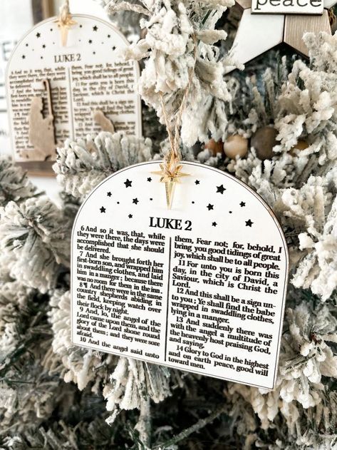 Decorate your home with Christian-themed Christmas trees featuring nativity scenes, scripture verses, and Jesus-inspired decor. Celebrate the true meaning of the season with these meaningful designs. Manger Christmas Ornament, Bible Ornaments Diy, Bible Verse Christmas Ornaments, Christmas Decor Christian, Nativity Themed Christmas Tree Ideas, Bible Verse Ornaments, Nativity Tree Christmas, Christmas Christian Decor, Jesus Christmas Decor