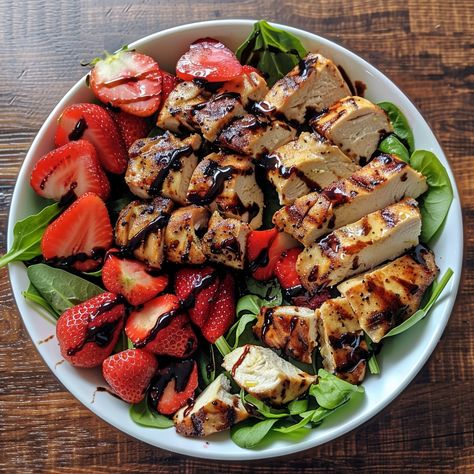 🍓🥗 Freshen up with Strawberry Chicken Salad and Strawberry Balsamic Dressing! Light, tangy, and delightful. #StrawberrySalad #HealthyEating Strawberry Chicken Salad with Strawberry Balsamic Dressing Recipe A vibrant salad that combines sweet strawberries with tender chicken, tossed in a homemade strawberry balsamic dressing. Ingredients: Chicken breast, grilled and sliced: 400g Fresh strawberries, sliced: 200g Mixed salad greens: 150g Feta cheese, crumbled: 100g Pecans, toasted: 50g For t... Strawberry And Avocado Salad, Grilled Chicken Salad Ideas, Strawberry Chicken Recipes, Salad With Strawberries And Feta, Strawberry Salad Recipes, Strawberry Balsamic Dressing, Strawberries Salad, Chicken Breast Grilled, Strawberry Fields Salad