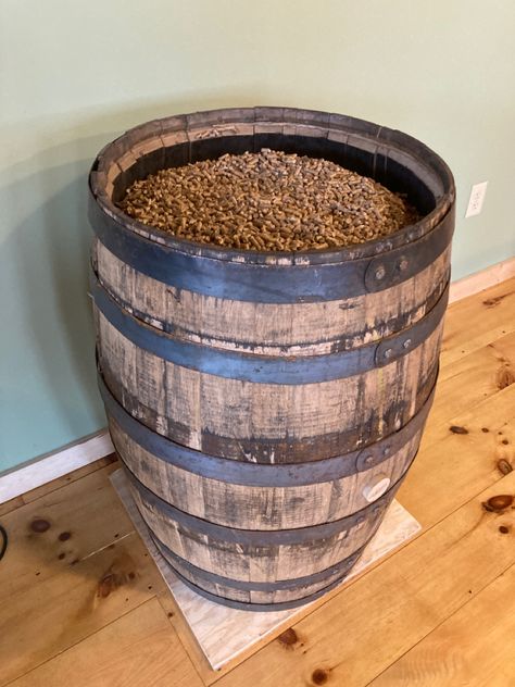 Repurposed Whiskey Barrel for pellet storage. Holds approximately 7-8 40lb bags. Pellet Stove Decorating Ideas, Pellet Stove Storage Ideas, Indoor Pellet Storage, Pellet Storage Ideas Living Rooms, Pellet Stove Pellet Storage Ideas, Pellet Stove Decor, Pellet Stove Basement, Basement Pellet Stove Ideas, Pellet Stove Fireplace Ideas