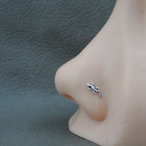 "A tiny Lizard Sterling Silver nose Stud. This nose stud is made of sterling silver so it is great for those with sensitive skin. The Lizard measures 7mm x 3mm The stud is made of 23g wire and has your choice of ball end or straight end. Ball End=6mm length Straight End= 9mm length. The straight end is bend to fit, it can be bent into an \"L\" shape. This listing is for one nose stud ( 1 piece)" Nose Piercing Cute Studs, Nose Piercing Stud Jewelry, Cute Nose Jewelry, Cute Nose Rings Studs, Nose Piercing Jewelry Studs, Aesthetic Nose Piercing Stud, Cute Piercings Nose, Cool Nose Rings, Cool Nose Piercings