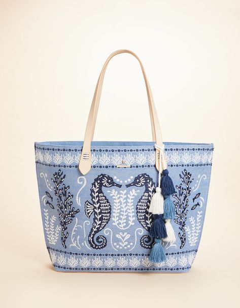 The best party is a beach party and our Fiesta Tote is always ready to come along! Decorated with an embroidered seahorse on a cotton and jute blend, this tote features a fun, tiered tassel fob and a faux leather bottom base to keep it dry. The custom, crosshatch patterned cotton interior features two slip pockets and one hanging zipper pocket. Embroidered Seahorse, Beach Bags Totes, Summer Totes, Spartina 449, Designer Tote Bags, Best Party, Beach Shop, Embroidered Bag, Beach Bags