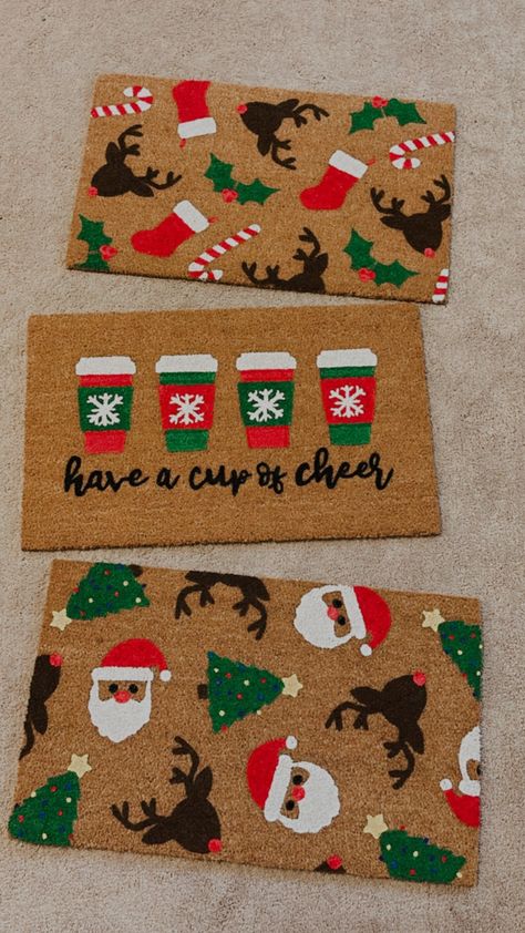 HAVE A CUP OF CHEER DOORMAT Christmas treats. Our Christmas coffee welcome mat is the perfect way to create a warm and inviting Christmas entryway. Front door mats make perfect wedding, housewarming, and birthday gifts!MATERIAL: natural coir front with a durable vinyl backingSIZES: 18" x 30" and 1/2 inch thick CARE: shake or vacuum to clean and refreshDESIGN: hand-painted with durable outdoor all-weather paint This hand-painted doormat is the perfect decorative accent to any entryway! Made with Christmas Mats Front Door, Door Mat Ideas Christmas, Doormat Ideas Christmas, Christmas Doormats Diy, Christmas Door Mat Ideas Outdoor, Diy Christmas Rug, Christmas Front Door Mat, Cute Doormat Ideas, Christmas Door Mats Diy