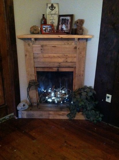 faux pallet fireplace, crafts, fireplaces mantels, living room ideas, pallet Pallet Fireplace, Faux Fireplace Mantels, Fake Fireplace, Faux Fireplace Diy, Fireplace Garden, Pallet Creations, Faux Fireplace, Kitchen Cafe, Corner Fireplace