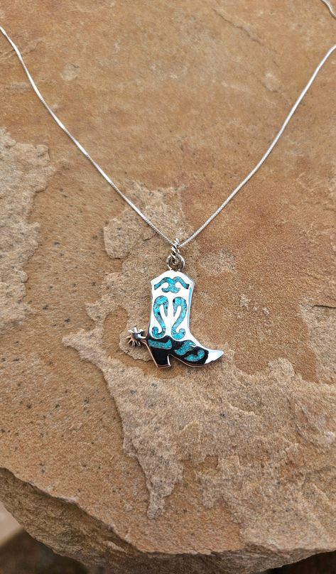 Expertly crafted with .925 sterling silver, this Dazzled in Turquoise Boot Pendant features a gorgeous turquoise chip inlay that adds a touch of vibrant color. Complete with a sturdy twenty inch chain, this pendant is the perfect accessory for any boot lover. Southern Jewelry, Turquoise Boots, Cowgirl Accessories, Kids Earrings, Western Jewelry, White Buffalo, Okra, Pink Opal, Green Turquoise