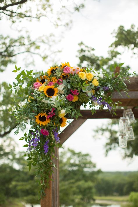 sunflower alter decor spring wedding Sunflower Garland Wedding, Spring Wedding Flowers With Sunflowers, Spring Wedding With Sunflowers, Wedding Arch Wildflowers, Sunflower Wedding Aesthetic, Sunflower Summer Wedding, Wedding Arch Entrance, Sunflower Arch Wedding, Sunflower Arch