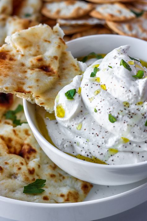 Whipped Feta is a an easy dip packed with fresh flavors. Feta cheese blended smooth and creamy with lemon and garlic. Eat with chips, pita, or crackers! Garlic Whipped Feta, Whipped Feta, On The Side, Feta Cheese, Pita, Crackers, Feta, Dip, Garlic