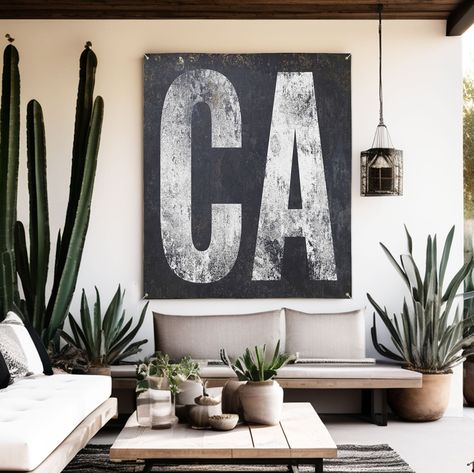 "Celebrate California's spirit with our 'CA' banner. White lettering on black, weather-resistant for indoor or outdoor. Embracing minimalist design, it's perfect for any setting, reflecting California's unique vibe. Durable and easy to hang, this banner blends style with state pride, making it an ideal addition to spaces wishing to capture the essence of the Golden State. From bustling cities to serene landscapes, it's more than decor; it's a statement of love for California.  HOW TO ORDER - VINYL BANNER  * MEASURE YOUR SPACE FIRST * To order, please just click the \"size\" & \"Add to Cart\" button at the top of the page and proceed to the checkout and leave personalized wording. * Your proof will be sent within 24-48 hours to your Etsy Email. * Production & Shipping 5-10 business days  VI Black And White Porch Ideas, Poolside Bar, Rustic Western Decor, Modern Farmhouse Home Decor, Art Palette, Patio Wall, Vinyl Decor, Vinyl Banner, Home Bar Decor