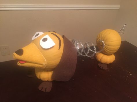 Slinky dog pumpkin #toystory #pumpkindecoratingideas Disney Decorated Pumpkins, Pumpkin Animals Ideas, Pumpkin Painting From Books, Boy Pumpkin Decorating Ideas, Slinky Pumpkin Craft, Pumpkin Animals Decorating, Kids Pumpkin Contest Ideas, Movie Pumpkin Decorating Ideas, Veterinary Pumpkin Decorating