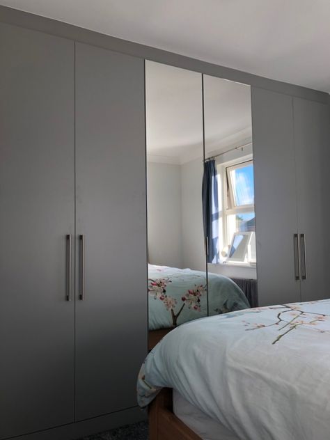 A recent installation of these pewter grey fitted wardrobes. A modern finish with the central mirrored doors add to the sense of space in the bedroom. Grey Wardrobe Bedroom, Grey Fitted Wardrobes, Modern Closet Doors, Grey Cupboards, Grey Wardrobe, Wardrobe Design Modern, Blue Bedroom Walls, Mirrored Doors, Bedroom Cupboards