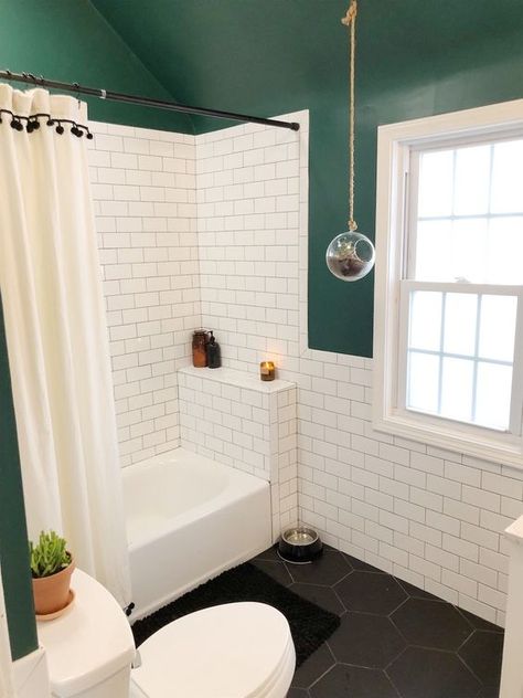 a small catchy bathroom with dark green walls and a ceiling, white subway tiles, black hex ones, a shower space and a window Bathroom Renovation Diy, Dark Green Bathrooms, Dark Green Walls, Bathroom Tub Shower, Bright Bathroom, Black Tile, White Subway Tiles, Bad Inspiration, Beige Bathroom