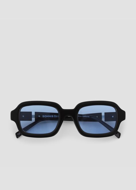 Thick squared acetate frames. Split temples with exposed stainless steel core wire. Black frames with blue lenses. Blue Lense Sunglasses, Designer Sunglasses Aesthetic, Frameless Glasses, Glasses Inspiration, Shy Guy, Bonnie Clyde, Blue Glasses, Cool Glasses, Fashion Eye Glasses