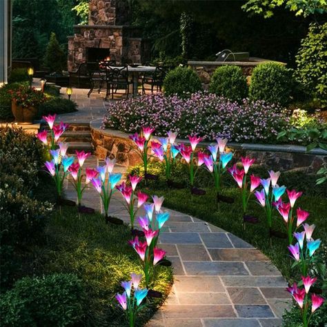 These Solar Powered Lily Flowers Are The Prettiest Way To Light Up Your Yard Best Outdoor Solar Lights, Solar Flower Lights, Solar Yard Lights, Solar Garden Stakes, Tattoo Plant, Solar Flower, Outdoor Garden Lighting, Yard Lights, Solar Powered Lights