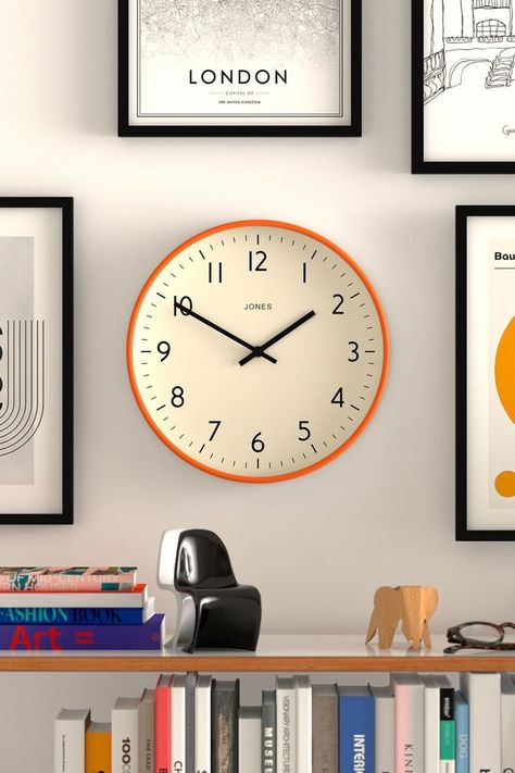 A bright and colourful wall clock with a modern and easy-to-read dial measured by linear hands and topped by a glass lens. The case has a contemporary matt finish. The ideal way to refresh an interior, this colourful wall clock will easily brighten up the kitchen, office or a children's bedroom. Specifications Size: HWD 30 x 30 x 4.3cm / 11.8 x 11.8 x 1.7in. Materials: Acrylic case, metal hands and glass lens. Colour: Mid Blue, Fizzy Orange or Eden Green. Movement: Quartz. This is a ticking clock. Power: Requires 1 x high quality branded alkaline AA battery (not included). Product Code Mid Blue: JPEN52MBL. Product Code Fizzy Orange: JPEN52FO. Product Code Eden Green: JPEN52EDG Wipe clean only. 75% Acrylic, 10% Glass, 10% Paper, 5% Metal. Wall Clock And Shelves, Clock Ideas For Living Room, Mens Room Accessories, Cute Wall Clock, Wall Clock Placement, Bright Office Decor, Clock On The Wall, Bedroom Clock, Eden Green