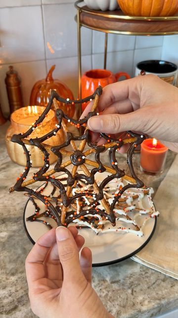 Sheri Wilson on Instagram: "Spooky Spiderwebs 🕸️🍫 these were so easy to make and perfect if you’re like me and love a sweet and salty combo!   -pretzel sticks -melting chocolate, white or dark -Halloween sprinkles  Place 8 pretzels onto parchment paper in a star shape. Melt the chocolate wafers according to the package directions, then pipe onto the pretzels to look like spiderwebs. Cover in sprinkles before the chocolate has set.   #halloweentreats #halloweencountdown #halloweenvibes #halloweenaesthetic #halloweenfood #spookyseason #spookytreats #autumnmood" Spiderweb Pretzel Sticks, Chocolate Pretzel Spiderwebs, Spiderweb Chocolate Pretzels, Spider Web Pretzels White Chocolate, Halloween Dipped Pretzel Rods, Halloween Pretzel Sticks, Spiderweb Dessert, Spiderweb Pretzels, Pretzel Spiderwebs