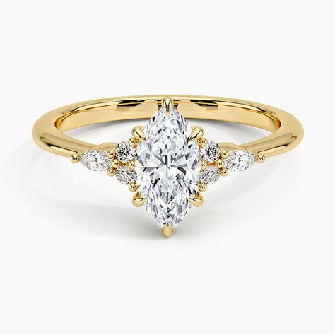 Marquise Cut Nadia Diamond Engagement Ring - 18K Yellow Gold. This elegant ring features a dazzling cluster of round and marquise-shaped diamonds that rest upon the shoulders of the gently tapered band. The center gem is held by four claw prongs as it sits upon a slightly open gallery (1/10 total carat weight). Marquise Cut Diamond Engagement Rings, Pear Cut Diamond Engagement Ring, Classic Diamond Engagement Ring, Three Stone Diamond Rings Engagement, Chic Rings, Three Stone Diamond Ring, Nature Inspired Rings, Lab Diamond Engagement Ring, Rose Gold Diamond Ring