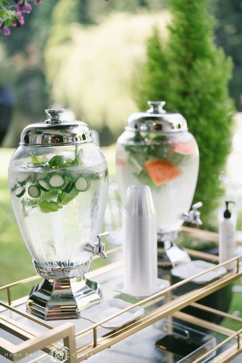 If you are planning a summer wedding and are worried about your guests overheating, save this photo as inspiration for an elegant water station. This water is infused with cucumber and watermelon to keep the guest feeling cool and happy during this summer wedding. Water Dispenser Wedding, Hydration Station Wedding, Water Station Wedding, Wedding Water Station, Cucumber And Watermelon, Cocktail Decor, Cocktail Pictures, Flavored Water Recipes, Glam House