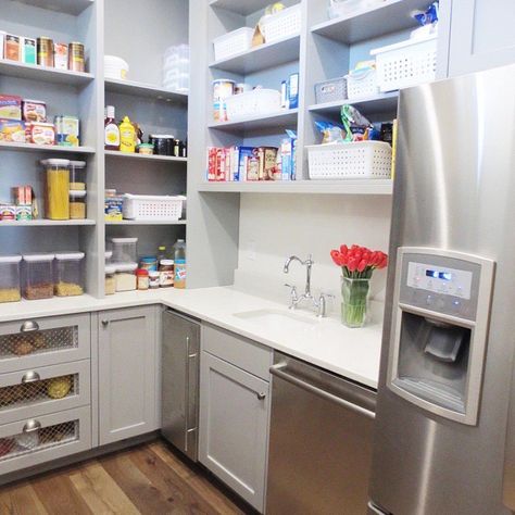 Can you imagine a pantry like this? Double oven, sink, dishwasher, ice maker (of course, the good ball ice) and full size refrigerator. It's another kitchen which is perfect for entertaining. What takes it over the top was when we matched the paint to the melamine shelves. Durable and Beautiful!  Twin Falls, Idaho soniabarneydesign.com Butler Pantry With Dishwasher, Butlers Pantry Sink Ideas, Butlers Pantry With Sink And Fridge, Dishwasher In Pantry, Walk In Pantry With Sink And Dishwasher, Pantry With Double Oven, Pantry With Sink And Dishwasher, Bulters Pantry, Melamine Shelves