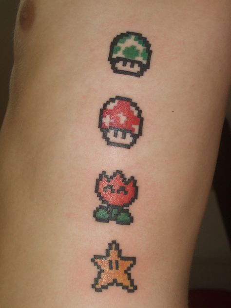 It's no surprise that people love Mario. He's been around for a few decades now and been the main star in so many classic video game adventures, cartoons and even a Hollywood movie! Mario Tattoos, Super Mario Tattoo, Nintendo Tattoo, Pixel Tattoo, Sister Tats, Game Tattoo, Mario Tattoo, Mario Star, Awesome Tattoo Ideas