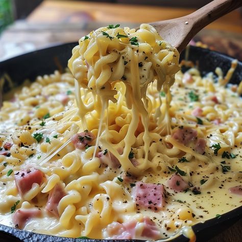 Cheesy Noodles with Ham Recipe Ingredients For the Noodles: 12 ounces egg noodles or your favorite pasta 2 cups diced ham 2 cups shredded cheddar cheese 1 cup shredded mozzarella cheese 4 tablespoons unsalted butter 1/4 cup all-purpose flour 2 cups whole milk 1 cup heavy cream 1 teaspoon garlic powder 1 teaspoon onion powder Salt and pepper to taste Fresh parsley, chopped, for garnish Instructions Cook the Noodles: Bring a large pot of salted water to a boil. Cook the egg noodles according ... Cheesy Noodles, Boil Cook, Cheddar Cheese Recipes, Ham Recipe, Shredded Cheddar Cheese, Buttered Noodles, Post Workout Food, Delicious Snacks Recipes, Seafood Dinner