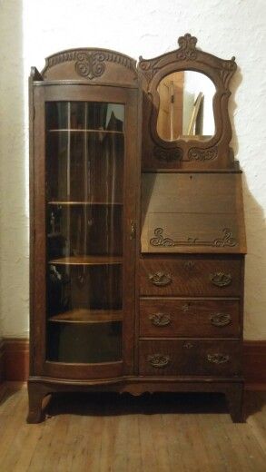 This is an Oak Secretary from the 1890's. It consists of a four book shelves, a drop down desk, drawers and a mirror. The piece has ornamental scroll work and beautiful trim. The bookcase front has curved glass. It has the original key that can be used to lock the bookcase, drawer and cabinet. This is a beautiful piece that would be a wonderful addition to any home or office. The price is $575.  If you are interested please send a message or give me a call at (937) 271-7170. Dimensions Height: 7 Secretary Desk With Bookcase, Ornamental Scroll, Desk With Bookcase, Drop Down Desk, Desk Drawers, Unusual Furniture, Dream Furniture, Secretary Desk, Victorian Furniture