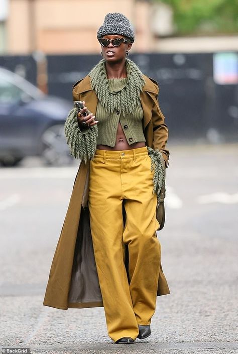 The 37-year-old donned a flamboyant ensemble when she met a friend for a coffee. The actress wore a pair of mustard coloured trousers with a relaxed straight leg fit and a dark sage green knitted cardigan, engulfed in extravagant fringe around the neck and cuffs Street Style Trousers, Teal Sweater Outfit Fall, Curdoroy Outfit Womens, Fringe Boots Outfit Fall, How To Style Green Sweater, Green Chelsea Boots Outfit, Cool Casual Outfits Women, Black Woman Fashion Outfits, Fringe Cardigan Outfit