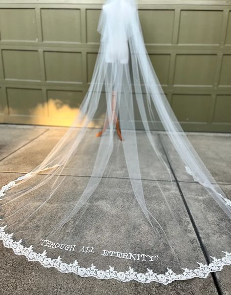 A striking study in grace and drama, this personalized embroidered wedding veil will be just as dramatic as Hailey Bieber’s! An elegant, sleek silhouette with an oversized embroidered monogram, phrase, lyric, or other custom word at the bottom gives this bridal veil an elegant personalized touch. Veil With Words, Classy Bridal Hair, Embroidered Wedding Veil, Dramatic Veil, Long Veils, Wedding Veils Headpieces, Lace Veils Bridal, Chapel Length Veil, Wedding Headbands