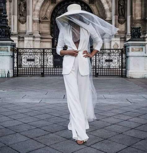 Channel your inner Bianca Jagger with this custom all-white bridal outfit from Alicia Rueda. The bridal hat paired with a pearl-embellished veil, flowing pants, and fitted blazer is just the look all modern brides would love for their chic city wedding or elopement. Find more trendy bridal hats at the link. // Photo: Xabi Vide Fotografia Wedding Trouser Suits, Bridal Hats, Blazer Wedding, Wedding Night Lingerie, City Bride, Bride Hat, Bridal Hat, Trouser Suit, Chic Brides