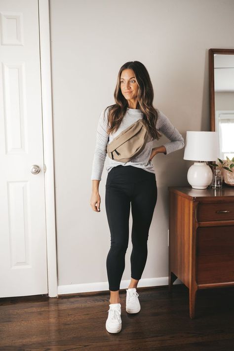 ashley wearing a gray tee, olive green belt bag, black leggings, and white sneakers standing next to a vintage wood dresser with a white table lamp Mini Capsule Wardrobe, Winter Look Book, Outfits Leggins, Mom Outfits Fall, Walking Outfits, Outfits For Work, Moda Chic, Fall Mini, Estilo Preppy