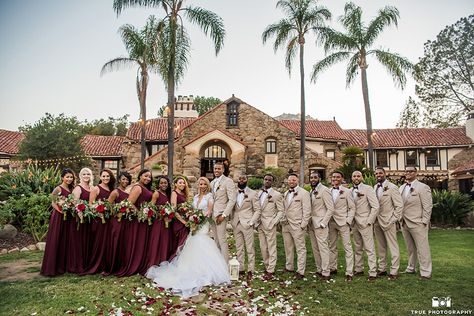 A Perfectly Dressed Bride and Groom Look Like... | Friar Tux Ivory And Burgundy Tuxedo, Beige Suit With Burgundy Tie, Groom Burgundy Suit Bridesmaid Dresses, Cabernet Groomsmen Attire, Champagne And Burgundy Wedding Groomsmen, Tan And Burgundy Groomsmen, Wine Bridesmaid Dress With Groomsmen, Burgundy And Tan Wedding Party, Tan And Maroon Wedding