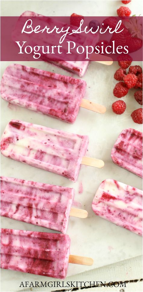 Creamy yogurt and fresh berries are swirled together to make hot summer days a bit cooler with these refreshing Berry Swirl Yogurt Popsicles. Homemade Popsicles are easy to make and delicious with fresh berries.  #yogurtpopsicles #popsicles #strawberrypopsicles #popsicles #yogurt #berries #homemade #recipe #summer Homemade Popsicles Healthy, Popcicles Recipes, Summer Popsicle Recipes, Yogurt Popsicle Recipes, Raspberry Popsicles, Fruit Popsicle Recipes, Homemade Fruit Popsicles, Berry Popsicles, Healthy Popsicle Recipes