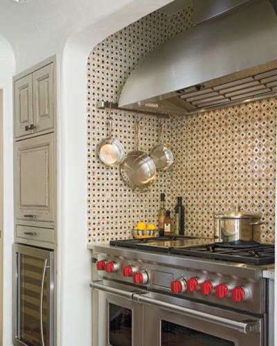 Vibrant mosaic tile in the cooking alcove spices up the stove area. Stove Alcove, 1960s Kitchen Remodel, Colonial Kitchen Remodel, Tiny Kitchen Remodel, Vintage Kitchen Remodel, Kitchen Remodel Pictures, Simple Kitchen Remodel, Small Kitchen Cabinets, Galley Kitchen Remodel