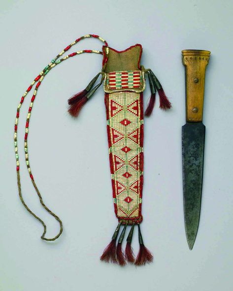 https://flic.kr/p/9ySnYw | Knife and Sheath | Knife and Sheath, ca. 1840, Northeast, Ojibwa, Knife: steel, bone, copper; Sheath: tanned hide, porcupine quills, seed beads, tin cones, red-dyed horsehair. WC8308030 Native American Knife Sheath, Quill Work, Porcupine Quills, Native American Artifacts, Native American Peoples, Native American Beadwork, Knife Sheath, American Indian Art, Bowie Knife