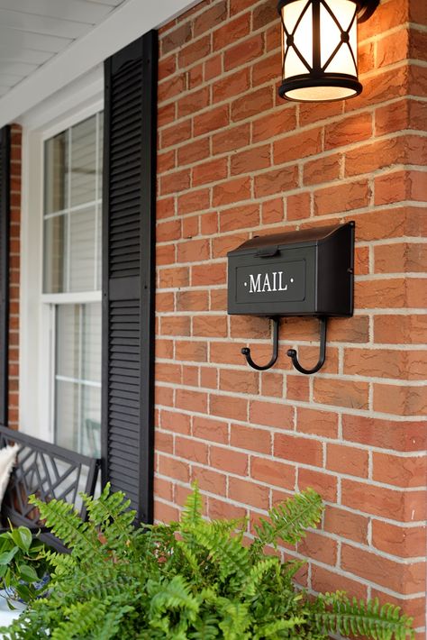 Black Shutters Red Brick House, Mailbox Ideas On House, Brick House With Black Shutters, Porch Decorating Ideas For Summer, Brick Bungalow Exterior, Shutters Brick House, Mailbox On House, House With Black Shutters, Lakehouse Exterior