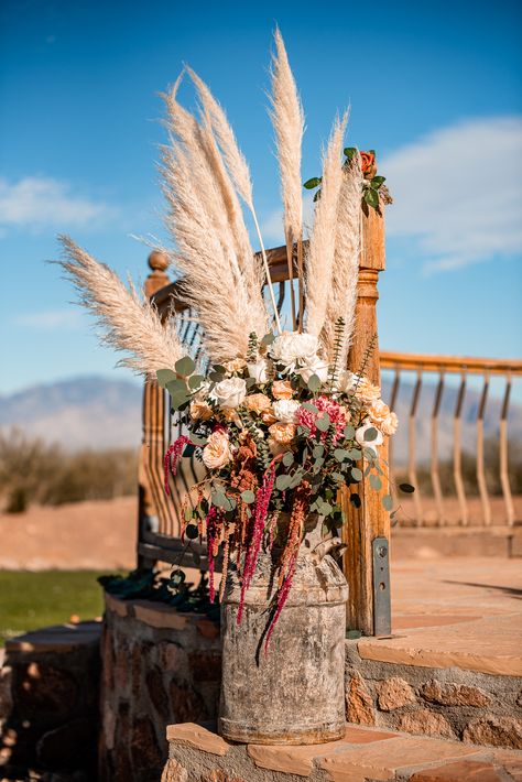 Wedding alter flowers, rustic theme, vintage milk jug. Cowboy Wedding Flowers, Boho Western Centerpieces, Country Western Wedding Table Decor, Western Wedding Altar, Cowboy Wedding Ideas Western Theme, Western Wedding Flower Arrangements, Western Isle Decorations, Rustic Cowboy Wedding Decor, Milk Jug Decorating Ideas