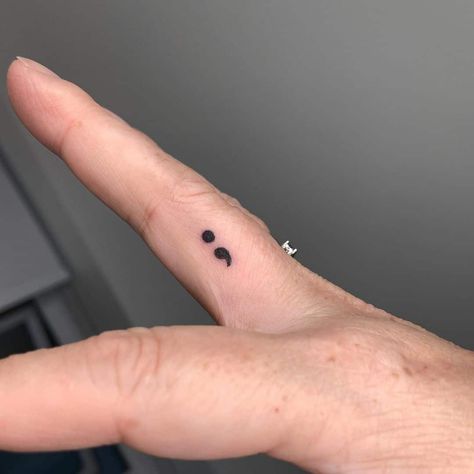 Hand Tattoos Semicolon, Stick And Poke Tattoo Ideas Semicolon, White Ink Tattoo Semicolon, Small Tattoo Ideas Semi Colon, Comma Tattoo Semicolon, Small Finger Tattoos Semicolon, Semi-colon Tattoo Ideas Finger, Tattoo Idea Semicolon, Semilicolon Tattoo