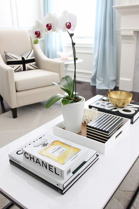 Coffee Table Makeover, box frame coffee table, white lacquered coffee table, orchid, chanel coffee table book, black white living room styling Chanel Coffee Table Book, Fashion Coffee Table Books, Coffee Table Books Decor, Coffee Table Inspiration, Coffee Table Makeover, White Coffee Table, Table Decor Living Room, Coffee Table Decor, Unique Coffee Table