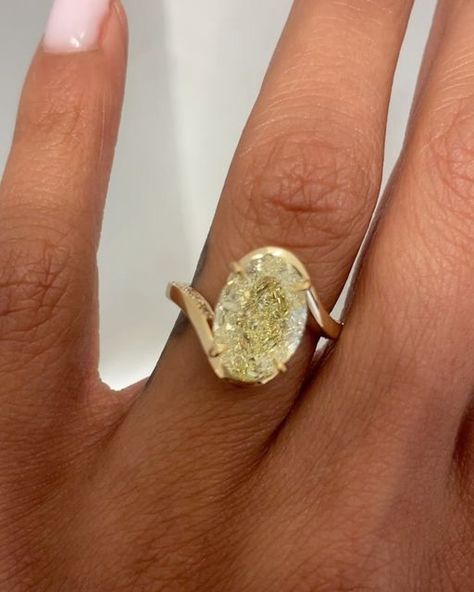 AARYAH on Instagram: "One of the most unique engagement rings we’ve ever made with a fancy yellow oval cut✨ ~ When we posted the video of this stunning bespoke ring, our DMs were flooded. This ring is truly one-of-a-kind, featuring a rare fancy yellow oval cut diamond with the most exquisite lemon hue. We had the honor of working with a wonderful couple who came to us with their unique vision for an engagement ring. They had a clear idea of what they wanted, and we were excited to bring their dream to life. Our journey began with an initial concept that included a bezel setting for the diamond. However, the couple wanted to ensure the body of the diamond had its own moment to shine. Over the course of three weeks, we collaborated closely, refining the design to perfectly encapsulate their Lime Green Engagement Ring, Unique Setting Engagement Ring, Aaryah Ring, One Of A Kind Engagement Rings, Oval Engagement Ring Unique, Engagement Rings Aesthetic, Champagne Engagement Ring, Unique Oval Engagement Ring, Canary Yellow Diamond Engagement Ring