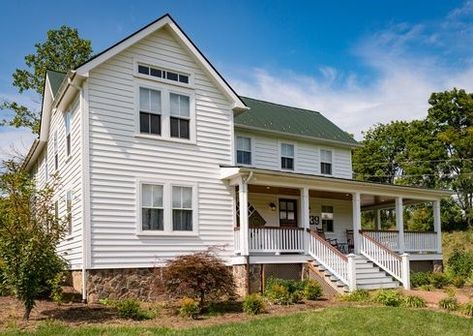 Traditional Bevel Clapboard painted cedar siding gives this farmhouse-style home lots of charm and an easy maintenance schedule. #cedar siding #woodsiding #woodlovers Painted Cedar Siding, Cedar Siding Exterior, Painted Siding, Farmhouse Restoration, Wood Siding Exterior, Siding Options, Farmhouse Colonial Exterior, Farmhouse Colonial, Colonial Exterior