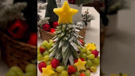 Turn A Pineapple Stem Into A Christmas Tree For A Festive Charcuterie Centerpiece Christmas Fruit Tray Ideas Xmas Trees, Pineapple Top Christmas Tree, Pineapple Christmas Tree Fruit Tray, Xmas Fruit Platter, Christmas Fruit Platter Holiday Parties, Christmas Tree Fruit Platter, Fruit Platter Christmas, Holiday Fruit Tray, Christmas Fruit Tray Ideas