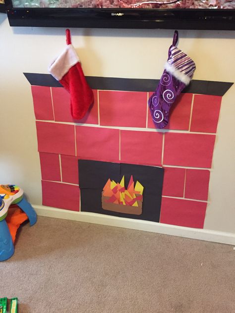 Construction paper fireplace! Paper Fireplace, Office Christmas Decorations Cubicles, Christmas Cubicle Decorations, Diy Christmas Fireplace, Cubicle Decor Office, Construction Paper Crafts, December Crafts, Christmas Shadow Boxes, Paper Christmas Decorations