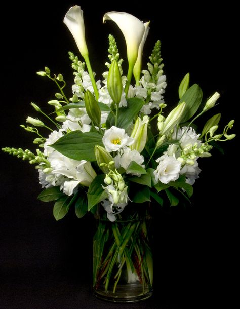 Exceptionally elegant - white calla lilies, white lisianthus and white snap dragons with simple green accents.  To view our entire selection please visit us at www.starflor.com #flowers #events #eventdecor Lilies White, Sympathy Floral, White Calla Lilies, Snap Dragon, Tropical Flower Arrangements, Flower Arrangement Designs, Vase Decoration, Flower Vases Decoration, Dendrobium Orchids