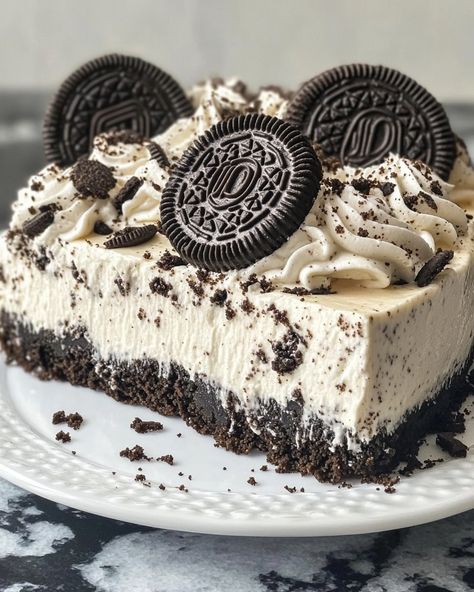 No-Bake Oreo Cheesecake 🖤🍪🍰 This No-Bake Oreo Cheesecake is a decadent, creamy dessert that combines the rich flavor of Oreos with a smooth cheesecake filling. It's perfect for when you want a delicious treat without turning on the oven! Ingredients: For the Crust: 24 Oreo cookies, crushed 1/4 cup unsalted butter, melted For the Cheesecake Filling: 2 (8 oz) packages cream cheese, softened 1 cup granulated sugar 1 tsp vanilla extract 1 cup heavy cream 1 cup crushed Oreo cookies (about 10 ... Oreo Cheesecake Aesthetic, Oreo Snacks, Cheesecake Aesthetic, Smooth Cheesecake, Crushed Oreo, No Bake Oreo Cheesecake, Dessert Photography, Vegan Bakery, Random Aesthetics