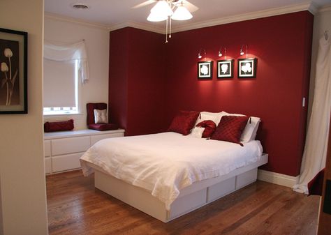 Trend: feature walls. Bold red wall in the guest room of a bedroom addition. Remodeling and addition by Martin Bros. Contracting, Inc. Red Accent Wall Bedroom, Maroon Bedroom, Red Bedroom Walls, Bedroom Painting Ideas, Maroon Walls, Red Bedroom Design, Red Accent Wall, Red Bedroom Decor, Feature Wall Bedroom