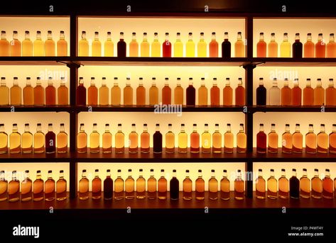 Download this stock image: Unmarked glass whiskey bottles displayed on backlit shelves - P4WT4Y from Alamy's library of millions of high resolution stock photos, illustrations and vectors. Backlit Shelves, Home Shelves, Ikea Billy Hack, Home Shelves Ideas, Whiskey Bottles, Bar Back, Floating Bookshelves, Shelves Ideas, Ikea Billy Bookcase