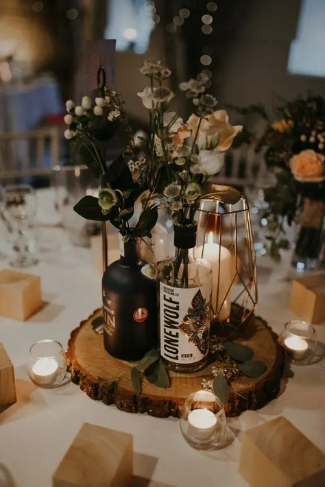 Rum Bottle Centrepiece, Rustic Centre Pieces For Weddings, Gin Bottle Wedding Centre Piece, Gin Bottle Centrepiece, Fairy Light Centerpiece Wedding, Liquor Bottle Centerpieces, Rustic Centre Pieces, Fairy Lights Wedding Centerpieces, Bottle Centrepiece