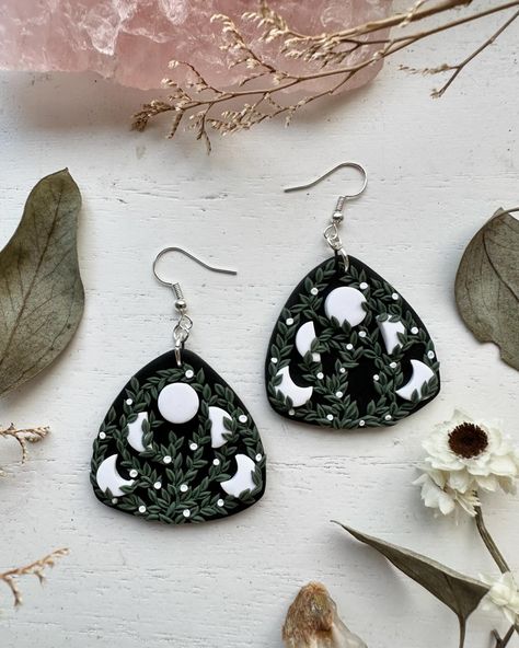 🖤 ear magic 🖤 Embrace the enchantment of the shadows with these handcrafted polymer clay earrings, where nature’s whimsy meets dark allure. Dare to adorn your ears with a touch of mystery. 🌙✨ . . . . #floralearrings #GothicEarrings #whimsicaljewelry #HandmadeJewelry #PolymerClayArt #etherealart #NatureInspired #clayearrings #DarkAesthetic #UniqueEarrings Amber Rae, Witch Crafts, Whimsical Jewelry, Polymer Earrings, Gothic Earrings, The Enchantments, Clay Earring, Ethereal Art, Polymer Clay Art